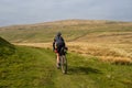 Cycling along the Pennine Bridleway between Newby Head Gate to Great Knoutberry Hill near to Ribblehead in the Yorkshire Dales Royalty Free Stock Photo