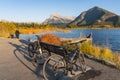 Cycling in Banff Legacy Trail and taking pictures at Vermilion Lakes lakeshore in autumn. Banff National Park