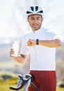 Cycling, bike and man with a smart watch, fitness and exercise with workout goal, training, and water bottle. Male