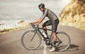 Cycling, energy and bike cyclist in a road along a mountain, power, focus and mindset in South Africa. Sports, fitness Royalty Free Stock Photo