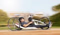 Cycling, fitness and speed with man and handcycle in nature for training, sports and challenge. Exercise, workout and