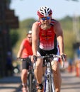 Cycling, happy man in beard and sun-glasses smiling Royalty Free Stock Photo