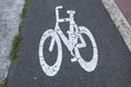 Cycling lane symbol on pedestrian path Royalty Free Stock Photo