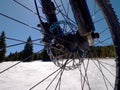 Cycling on large tyres in fresh snow. Biker goes by bike on the snowy road Royalty Free Stock Photo