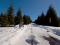 Cycling on large tyres in fresh snow. Biker goes by bike on the snowy road Royalty Free Stock Photo