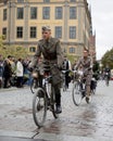 Cycling man wearing old fashioned military clothes