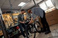Cycling mechanics assembling new bike in workshop