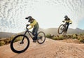 Cycling, mountain bike jump and man travel on dirt path for extreme sports adventure, journey or training for marathon Royalty Free Stock Photo