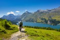 Cycling in the mountains passing through a lake