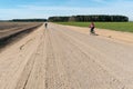 Cycling in nature. bike trip on a warm Sunny day on an empty dirt road. Road without cars along the forest. Weekend in nature with