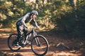 Cycling, nature and health with man in road for training, workout or cardio exercise. Adventure, extreme sports and