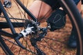 Cycling, repair and tire with hands of person in nature for fixing, adventure and safety. Fixing, ready and check with