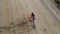 Cycling road bike, woman bicycle rider from top, aerial view, shot from above, man cyclist on empty road Royalty Free Stock Photo