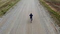 Cycling road bike, bicycle rider from top, aerial view, shot from above, man cyclist on empty road Royalty Free Stock Photo