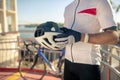 Bicycle helmet in male hands in gloves