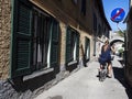 Cycling scene in an old italian alley