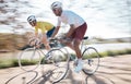 Cycling, speed and men on bicycle with motion blur for adrenaline, extreme sports and action on road. Fitness, mountain