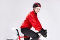 Cycling Sport Concepts. Young Positive Female Road Cyclist Posing With Modern Race Bike Against White Background