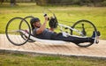 Cycling, sports and fitness with man and handcycle on road for training, bike and challenge. Exercise, workout and