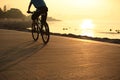 Cycling at sunrise seaside