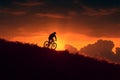 Cycling into the sunset mountain bikers silhouette against dusk sky