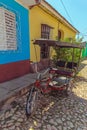 Cycling taxi near Houses in the old town, Trinidad Royalty Free Stock Photo