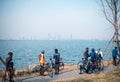 Cycling team riding along the lake, Wuhan, China