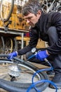 Cycle mechanist working on bike tires in workshop