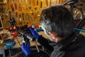 Cycle mechanist working on bike in workshop