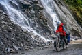 Cycling through the Tiger Leaping gorge Royalty Free Stock Photo