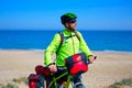 Cycling tourist cyclist in Mediterranean beach