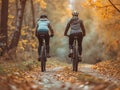 Cycling. two people with bicycle on a forest road in the mountains on a spring day Royalty Free Stock Photo