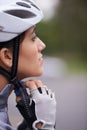 Cycling, woman and adjust helmet for safety, protection and exercise gear to travel outdoor. Bicyclist, person and