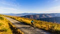 Cycling woman riding on bike in autumn forest landscape. Woman cycling MTB flow trail track. Outdoor sport activity Royalty Free Stock Photo