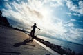 Cycling woman riding Mountain Bike on sunrise seaside Royalty Free Stock Photo