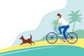 Man riding a Bicycle on the beach with the dog. Seascape with palm trees in the