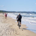 Cyclist on the beach of Swinoujscie in Poland