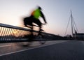 Cyclist on a bicycle bridge in Odense, Denmark