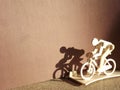 cyclist on a bicycle made of wood on a brown background