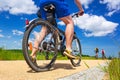 Cyclist on the bicycle road at sunny day