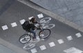 Cyclist on a bike lane during a traffic regulated day in Barcelona.