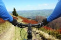 Cyclist on bike rides on a mountain road Royalty Free Stock Photo