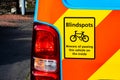 Cyclist Blindspot warning sign, stuck on the back of a blue van Royalty Free Stock Photo