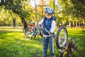 Cyclist boy Bike repair. little boy fixing his bike. Children mechanics, bicycle repair profession. Learning about cycles and Royalty Free Stock Photo