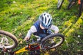 Cyclist boy Bike repair. little boy fixing his bike. Children mechanics, bicycle repair profession. Learning about cycles and Royalty Free Stock Photo