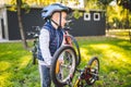 Cyclist boy Bike repair. little boy fixing his bike. Children mechanics, bicycle repair profession. Learning about cycles and Royalty Free Stock Photo