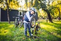 Cyclist boy Bike repair. little boy fixing his bike. Children mechanics, bicycle repair profession. Learning about cycles and Royalty Free Stock Photo