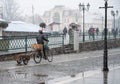 Cyclist on the city roadway on a rainy day in motion blur Royalty Free Stock Photo