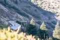 Cyclist climbing up a winding mountain road in southern Spain