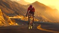 Cyclist conquering the mountain road at sunset, active lifestyle and endurance. Outdoor sports in nature's golden Royalty Free Stock Photo